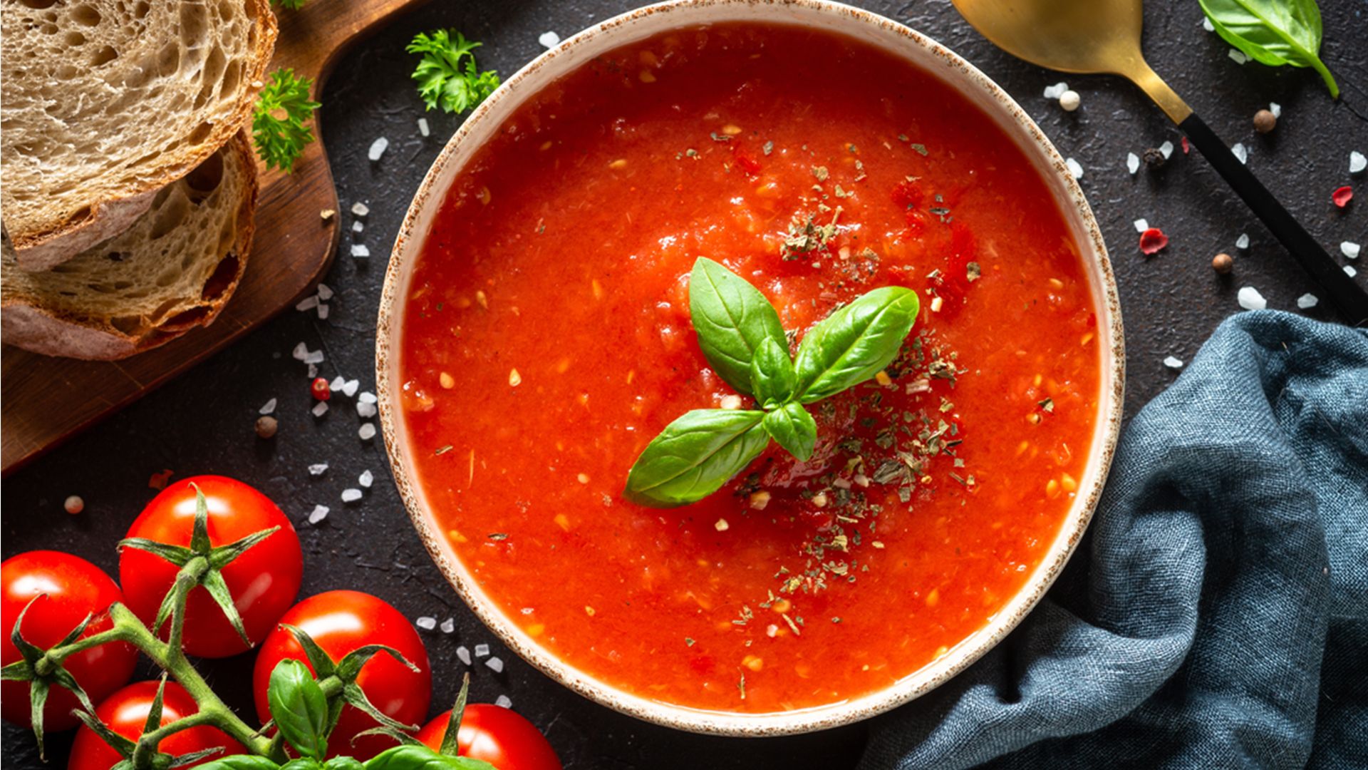 Bowl of soup with Tomatoes and bread